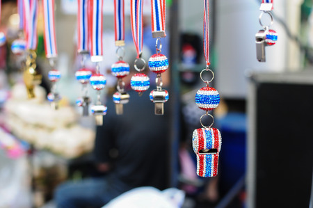 BANGKOK THAILAND - FEBRUARY 9, 2014   Whistles and national flag tri-coloured ribbons, Tools and or...