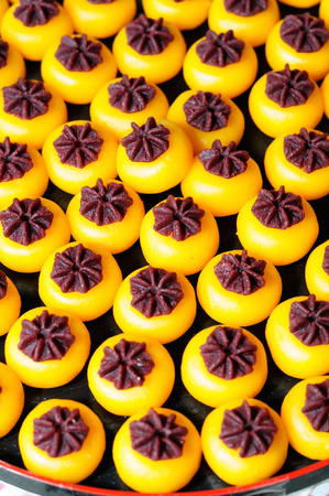 Kanom sanay chan made from minced coconut mixed with flour, sugar, egg yolk, rice flour and chan herbの写真素材