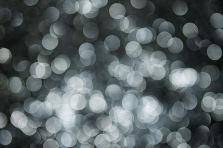 defocused abstract black silver lights background