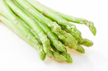 fresh green asparagus isolated on white backgroundの写真素材