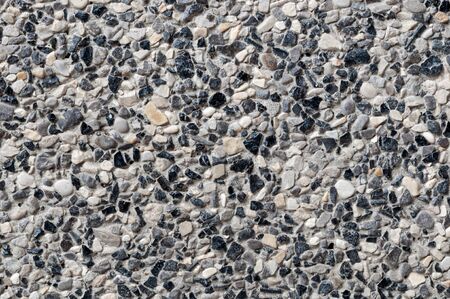 closeup of black stone wall texture abstract backgroundの写真素材
