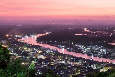 Beautiful sunset over the estuary community view from Mut Sea mountain, Chumphon, Thailandの写真素材
