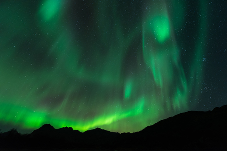 Northern lights over the mountain, Lofoten islands, Norwayの写真素材