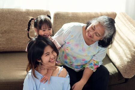 Happy Asian family having fun in their house, love and happiness people concept with home