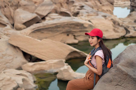 Young Asian traveler woman traveling at SAM PAN BOK in the morning, Ubon Ratchathani, Thailandの写真素材