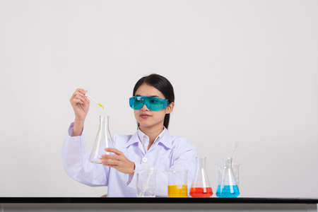 Young Asian women scientist with test tube making research in clinical laboratory, Science and chemistry concept, Medical technologistの写真素材