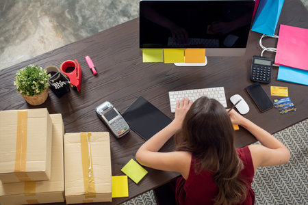 Young woman working at her office, Startup small business entrepreneurの写真素材