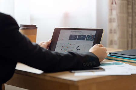 Portrait of Successful business woman working at the office with tablet