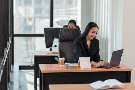 Portrait of Successful smiling businesswoman working in the officeの写真素材