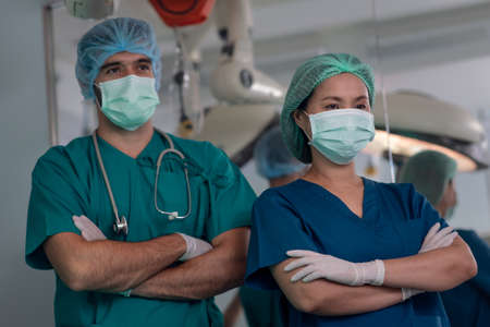 Team of professional doctors performing operation in surgery room, Healthcare and Medicalの写真素材