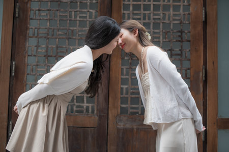 Happy Asian lesbian lgbtq couple dating in love kissing each other, spending time together