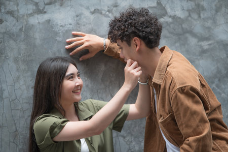 Asian young couple looking each other, male and female spending time together