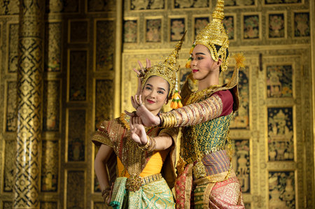 Pantomime (Khon) is traditional Thai classic masked play enacting scenes from the Ramakien (Ramayana) with a backdrop of Thai paintings in a public place at Wat Phra Khao, Ayutthaya province, Thailandの写真素材