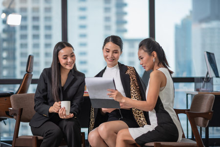 Young Asian Businesspeople working in the office, meeting to discussing business plan, Power of cooperation, Business team conceptの写真素材