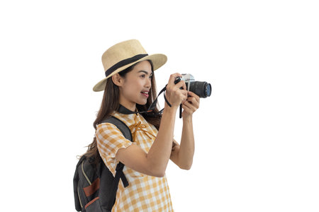 Young Asian women tourist holding a camera isolated on white background