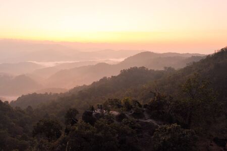 Sunrise with mist on mountain in UMPANG,THAILANDの写真素材
