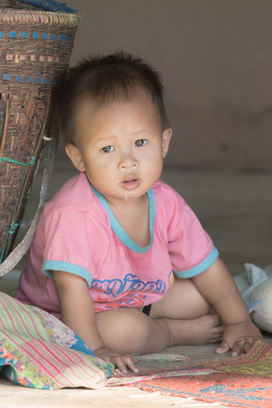CHIANG MAI, THAILAND - FEB 22: Portrait of unidentified hill tribe children in his village on February 22, 2014 in Chiang Mai, Thailand.のeditorial素材