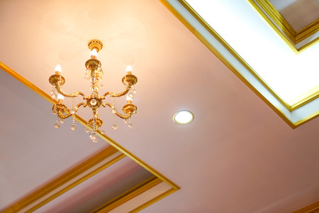 Simple and minimize chandelier gold colour on the ceilingの写真素材