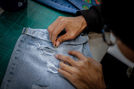 Arts and decoration blue jean by paint pull thread in department store Thailand.の写真素材