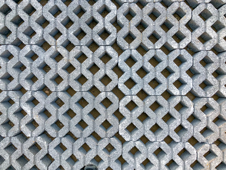 gray color stone brick block floor tile with green grass and sand as background or texture.