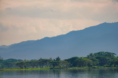 Mountain and Lake with the unique cloud in the Phayao lake, province of the North of Thailand.の写真素材