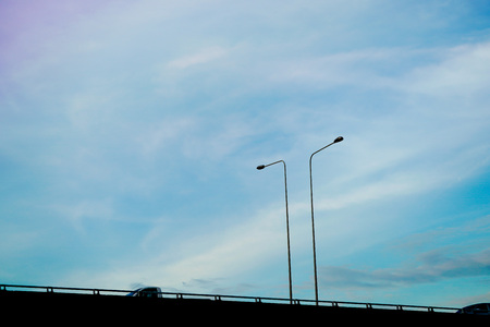 Clearly beautiful blue sky with expressway tuck and lamp post.の写真素材