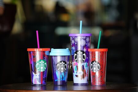 BANGKOK, THAILAND - 15 November, 2017: Starbuck souviniers arranged in the line on the wood table with blur background, to present the holiday gift to special preson.のeditorial素材