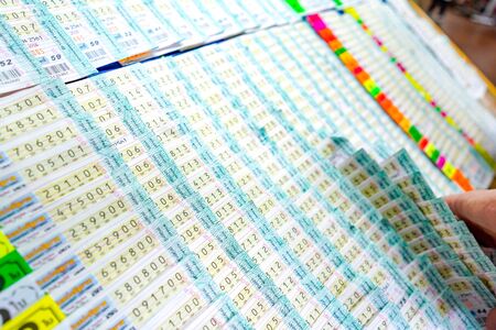 Bangkok, Thailand - 27 May 2018: Thai people have fun to buy lottery at the front of lottery kiosk at Bangkok downtown, Thailand.のeditorial素材