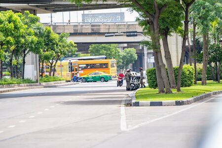 Bangkok, Thailand - 17 June 2018: Three Thailand traffic police / cop on duty at the road near the junction, Bangkok Thailand.のeditorial素材