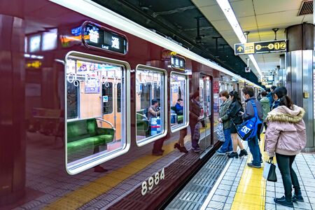 Osaka, Japan - 3 Mar 2018: Passengers walk and sit in the local underground Japan Train no. 8984 and going to the next train station, Namba, Osaka, Japanのeditorial素材