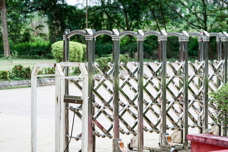 aluminum barricade with wheel below, can stretch and fold. settle at the front of the Laos immigration checkpoint.の写真素材