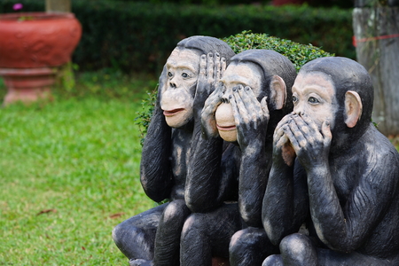 three black monkeys statue siting on the rock in the row; close eyes, close mouth, close ear., Thailandの写真素材
