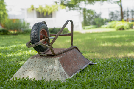 trolley construction parking on the grass field in the garden at noon.の写真素材