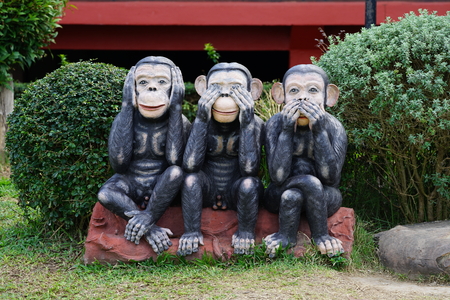 three black monkeys statue siting on the rock in the row; close eyes, close mouth, close ear., Thailandの写真素材