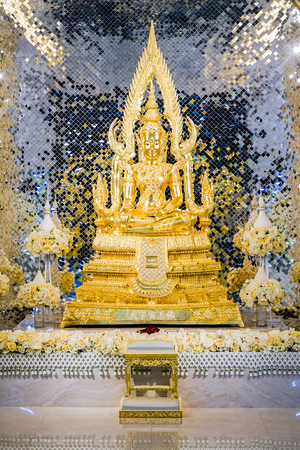 gold buddha statue front of luxury background.の写真素材