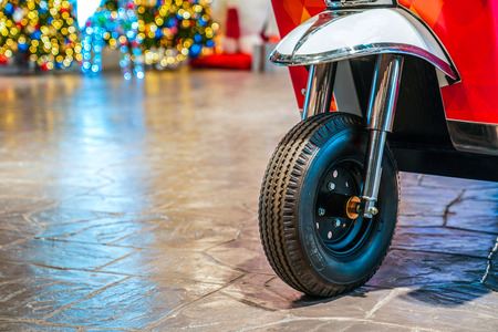 Closeup - focus concept on new TukTuk; Thailand traditional car, front of tire wheel. With colourful...