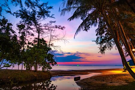 Purple violet sky at the beach and sea, in Twilight Time, Koh Kood, Trad province, Thailand.の写真素材