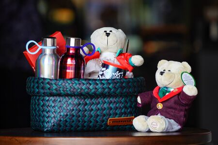 BANGKOK, THAILAND - 15 November, 2017: Starbuck souviniers and beverage arranged in the line on the wood table with blur background, to present the holiday gift to special preson.のeditorial素材