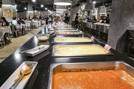 BANGKOK, THAILAND - 22 Nov, 2017: Tourists have dinning in the international buffet restaurant and wating for next programe show at Rama 9 district, Bangkok, Thailand.のeditorial素材
