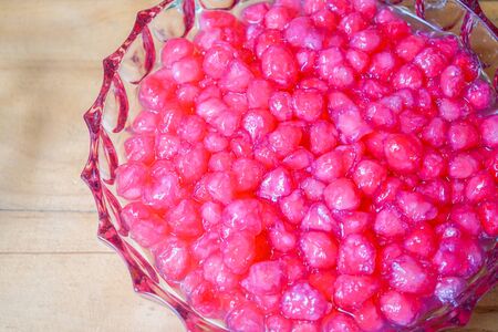 TubTimKrob is the waterchestnut in coconut milk Thailand dessert. It's vintage crispy traditional dessert eat with ice, syrup or milk in summer season.の写真素材