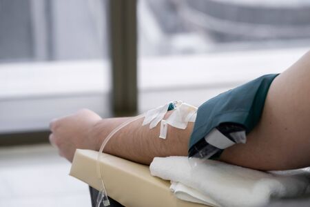 close up to Asian arm that receive vitamin from woman care clinic.の写真素材