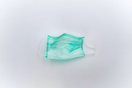 isolated Hygienic Mask (green color) in studio light on white background.