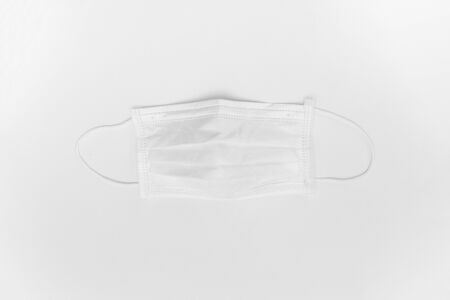 isolated Hygienic Mask (white color) in studio light on white background.の写真素材