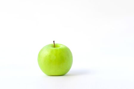 fresh green apple on clear solid and white background in studio light.の写真素材