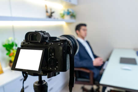 Bangkok, Thailand - 25 Oct 2019: Sony A7 mark 3 (A7iii) in backside steady on tripod to video recording Businessman was interviewed in his room. Bangkok, Thailandのeditorial素材