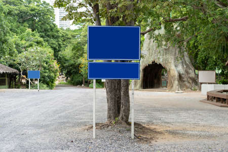 Blue traffic sign in paking lots with tree around. Clipping Pathsの写真素材