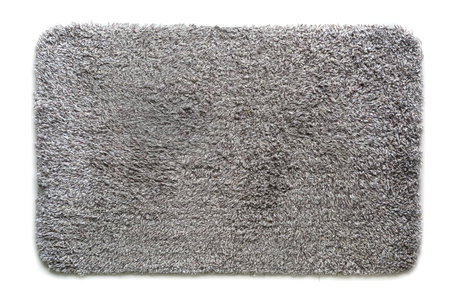 Close up used white - gray - brown doormat for any old vintage design style.の写真素材