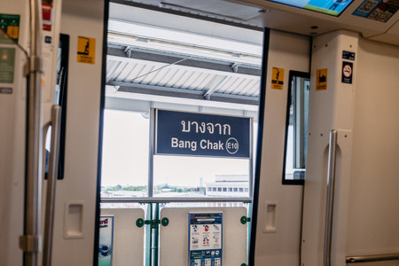Bangkok, Thailand - 30 Jul 2020, The door open from inside the BTS (Bangkok (Mass) Transit System platform) train and the Banner of BANG CHAK station is appeared, Bangkok, Thailand.のeditorial素材