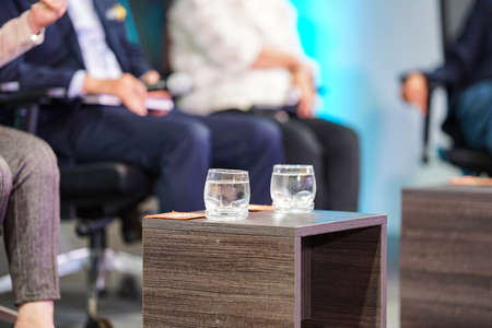 Glass of Water are prepared for speaker and the discussion session on stage