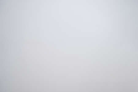 A little mottled bright white wall plain and solid for minimal object background.の写真素材